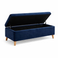 Banc de rangement en velours bleu avec pieds en bois - 2026