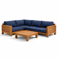 Salon de jardin en bois avec coussins bleus et table basse - 2026