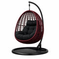 Fauteuil suspendu œuf avec support en rotin résine rouge et noir avec coussin en polyester - 2026